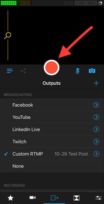 Pressing the record button in the Switcher Studio app to livestream your Facebook event.